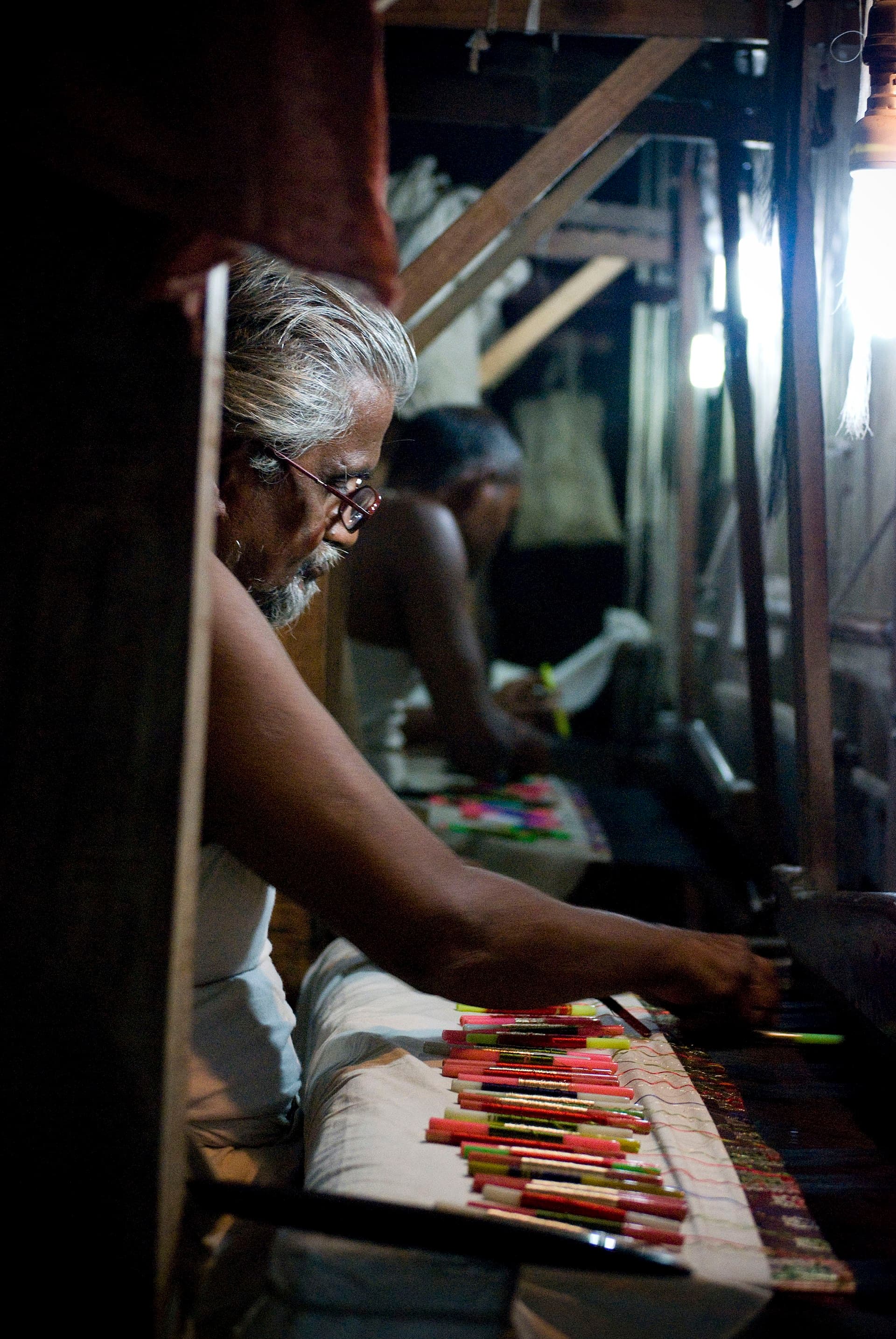 Traditional silk looms at a Banarasi weaving workshop
